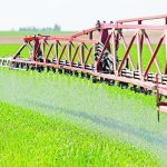 Liquid nitrogen fertilizer is applied to a wheat field near Deggendorf, Germany, in this file photo. European farmers have not able to stock up on fertilizer ahead of planting next spring because of high prices and tight supply. | Reuters/ Michaela Rehle photo