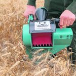 The Bushel Plus Mini Combine takes a grain sample from standing crops, which can be put through a moisture tester to see if a field is ready to harvest. | Bushel Plus photo