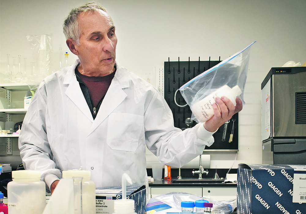 University of Lethbridge professor and researcher Dan Johnson holds a sample of the bio-pesticide he and his colleagues developed about 10 years ago that proved effective in grasshopper control. Despite several efforts, the treatment has never been commercialized. | Barb Glen photo