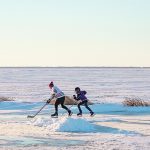 Steel Genaille of Souris, Man., and Jackson Fleury of Oak Lake, Man., took advantage of nice weather Nov. 25 to play
one-on-one hockey on Oak Lake at sunset. | Sandy Black photo