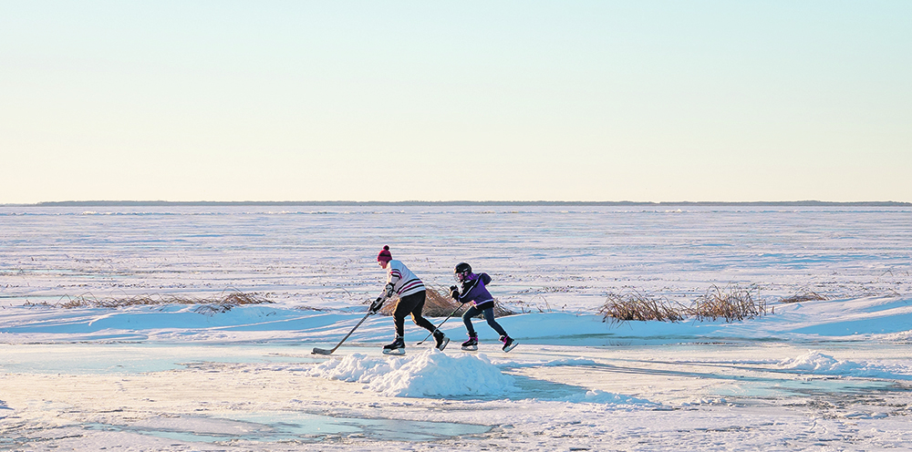 Steel Genaille of Souris, Man., and Jackson Fleury of Oak Lake, Man., took advantage of nice weather Nov. 25 to play 
one-on-one hockey on Oak Lake at sunset. | Sandy Black photo