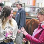 Rebecca Hess of Ottawa enjoys a laugh with federal agriculture minister Marie-Claude Bibeau during Canadian Western Agribition in Regina. Hess has been working for Harvie Ranching at Olds, Alta. | Mike Raine photo