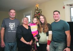 Dale, left, Jan, Olivia, Samantha and Anthony Eliason are at home on Golden Dee Farms near Outlook, Sask.  |  Karen Briere photo