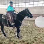 Judy Wright takes aim as she practices the sport of cowboy mounted shooting. Shooters use two .45-calibre, single-action revolvers, each carrying five rounds of black-powder blanks that have an effective range of 10 to 15 feet, which is enough to burst an inflated balloon. | Christalee Froese photo