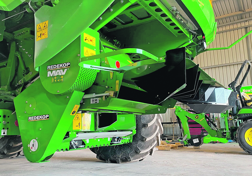 Redekop manufactures a harvest seed control unit that crushes weed seeds before they exit the combine. Sales are picking up in North America, but many growers want more data on the economic and agronomic benefits of the seed mills.  |  Redekop  photo