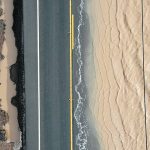 Flood water washes over a highway running through farmland near Salinas, California, last week. The recent deluge in that state could be an indication that the three-year La Nina is finally winding down. | Reuters/David Swanson photo