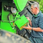 John Deere’s HarvestLab 3000 grain sensor attaches to the clean grain elevator on 2018 and newer John Deere S700 series combines. As the combine moves through the field, an auger pushes grain in front of the near-infrared sensor. The sensor provides real-time readings of protein, starch and oil values of crops being harvested. | John Deere photo