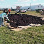 Volunteers at the Prairie Urban Farm on the University of Alberta’s South Campus get started on a new plot. | Debra Davidson photo