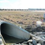 Rachel McQuiggan collects water quality samples at a stormwater inlet. She says it’s important to consider placement, depth and frequency of monitoring groundwater to get the full picture. | Scott Andres photo