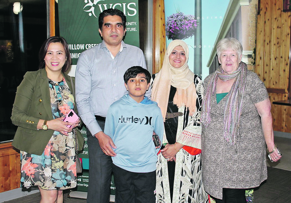 Umber Naushen, second from right, a Rural and Northern Immigration Pilot candidate, emigrated from Pakistan with her family through RNIP and arrived in Claresholm, Alta., in January 2022. She’s seen here with her spouse, Muhammud Tariq Maqsood, second from left, their youngest son, Muhammad Sameed, Roan Santos, left, a settlement counselor with Willow Creek Immigrant Services, a project of the Calgary Catholic Immigration Society, and Marie Schooten, right, volunteer co-ordinator with the WCIS.  |  Photo supplied by Lisa Degenstein