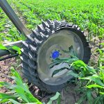 The Swift wheel produced by Shark Wheels is a replacement for conventional irrigation tires. Regular irrigation tires push soil away from the footprint, creating trenches up to 14 inches deep in side-by-side field testing. The Swift wheel pulls soil into the centre of the footprint, leaving only a one-inch scratch on the surface. | Photos supplied by Shark Wheels