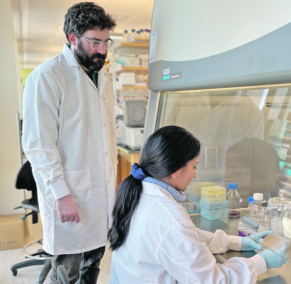 Tony Ruzzini of the University of Saskatchewan’s Western College of Veterinary Medicine, seen here with Poonam Dhindwal,  says an enzyme that can deactivate medication was found in a feedlot watering bowl, but the problem might extend beyond cattle to other types of livestock.  |  Photo supplied by Tony Ruzzini