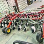PAMI researcher Charley Sprenger used a 65-foot 2010 Bourgault Paralink hoe drill 3310 with a 6550 cart to find out if fan speed affects seed damage rates in peas. This rig has six secondary manifolds, each with 11 openers, for a total of 66, a configuration with the potential for increased seed damage. It was chosen from a list of commonly used seeder set-ups in Manitoba. | Charley Sprenger PAMI photo