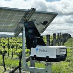 A self-contained BioScout unit is installed at a fruit field. Air is drawn into the device and particles are caught on a sticky strip and photographed using automated microscopy. These images are compared to a database of pathogens to provide an early warning system to the farmer. BioScout is running pilot projects on numerous diseases, including sclerotinia, cereal powdery mildew, various cereal rusts and grey mould in cannabis and hemp. | BioScout photo