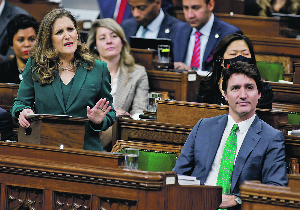Federal finance minister delivers this year’s budget March 28 while prime minister Justin Trudeau listens. The budget includes a large spending package aimed at mitigating the effects of climate change, and much of this involves agriculture.  |  Reuters/Blair Gable photo