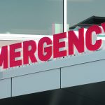 Close-up of the "Emergency" sign on a hospital.