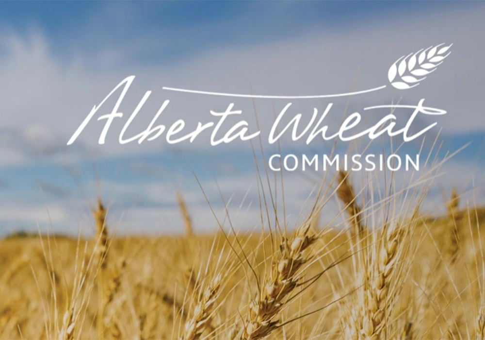 A field of wheat with the stylized "Alberta Wheat Commission" written on it.