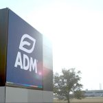 An ADM sign outside a large, corporate office.