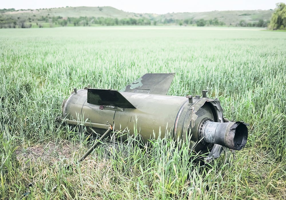 A piece of a rocket lies in a farm field in Ukraine.