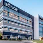 A photo of a Bunge office building with the company name on one side of the building near the roof.