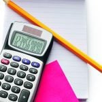 Picture of a calculator with a pencil laying nearby.