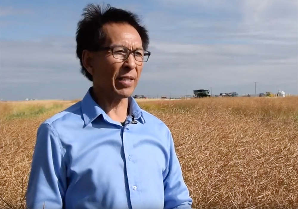 Former Agriculture Canada research scientist Yantai Gan standing in a field.