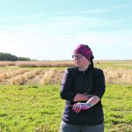Agriculture Canada entomologist Meghan Vankosky is standing in a field where she is researching trap crops.