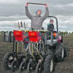 Researchers use a small planter to plant seed trials at the University of Saskatchewan.
