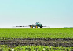 A sprayer in the distance shot from ground level.