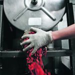 Butcher Brett Marley holds freshly ground beef at Casey's Market in Western Springs, Illinois.