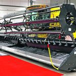 A new combine header is on display at a farm show in Regina recently.