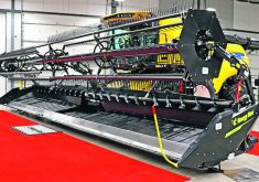 A new combine header is on display at a farm show in Regina recently.