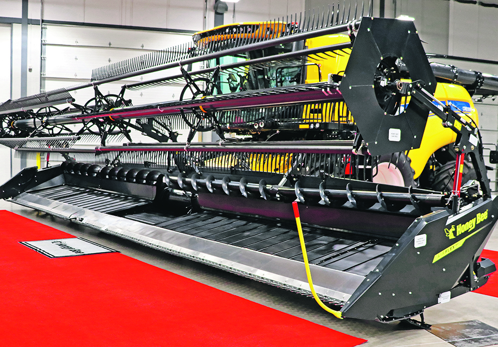 A new combine header is on display at a farm show in Regina recently.