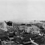 An archival, aerial, black and white photo showing some of the damage caused by the "Regina Cyclone" in 1912.