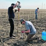 Workers at Innovation Farms, northwest of Winnipeg, are installing sensors across the farm to collect data.