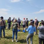 Journalists from arround the world check out a canola field during a crop tour as part of the recent International Federation of Agricultural Journalists' conference.