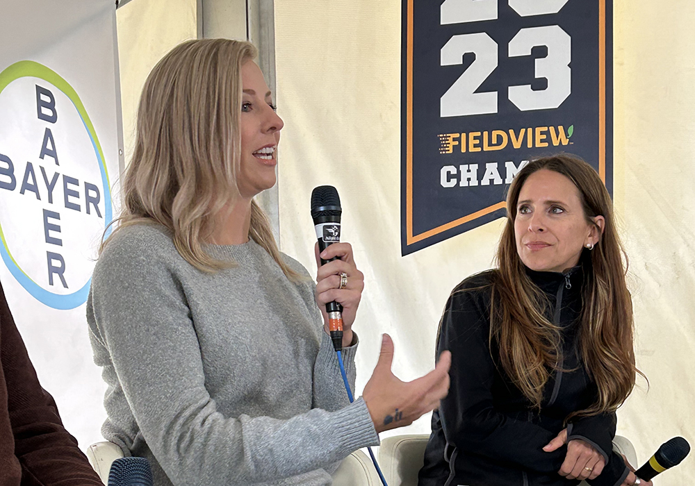 Regan Ferguson of Melfort, Sask., explains her and husband Mike's decision to buy a Climate FieldView digital agriculture platform. Bonnie Mandziak moderated the roundtable held at Ag in Motion July 18. | Jeff Melchior photo