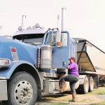 Leanne Kotylak climbs into her truck.