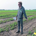 Carlo Van Herk, research technician at Farming Smarter, describes the organization’s strip-till canola research at a field school event near Lethbridge, Alta. | Doug Ferguson photo