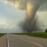 A tornado touches down next to a highway in Manitoba.