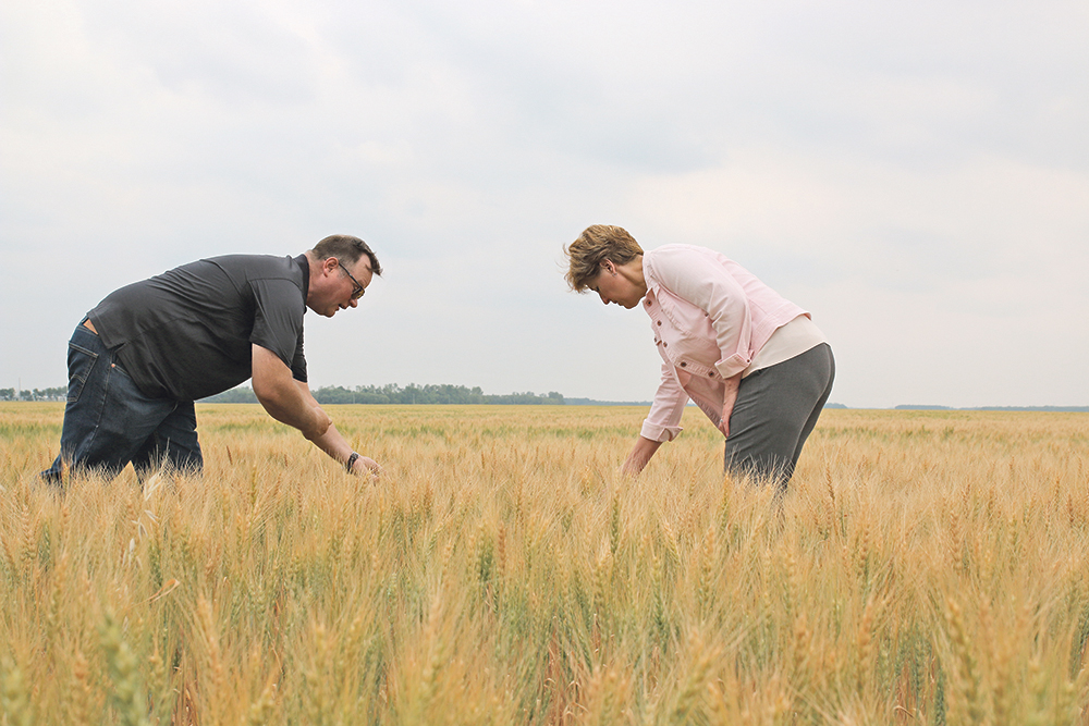 Federal agriculture mininster Marie-Claude Bibeau tours a Manitoba farm hit by drought in 2021. She recently met with provincial agriculture ministers during an annual meeting in Fredericton, N.B. | File Photo