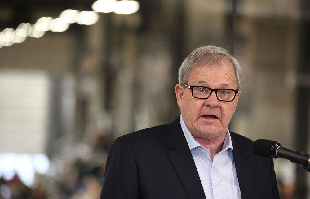 Lawrence MacAulay in front of a microphone in 2017