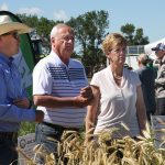 Alberta agriculture minister Nate Horner, Saskatchewan agriculture minister David Marit and federal agriculture minister Marie-Claude Bibeau at a crop plot at the Ag in Motion farm show.