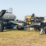 A large air seeder with tank in front and cultivator in the back