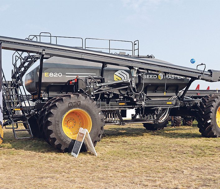 A large air seeder with tank and auger in transport position