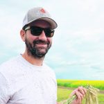 Matthew Enright, of Rosalind, Alta., holds hybrid rye he pulled from his field for his talk at the Battle River Research Group’s field day. Enright has added hybrid rye into his farm’s rotation. | Mary MacArthur photo