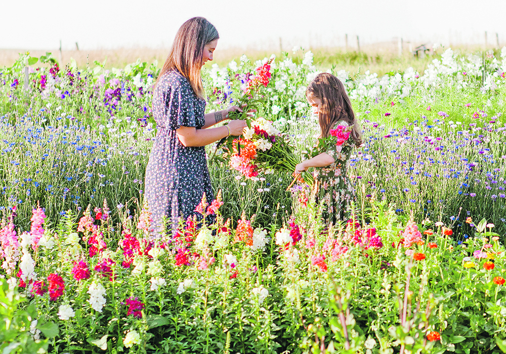 Kristen Primrose and daughter Shiloh spend time together in the flower patch.  |   Kinsey Holt Photography photo