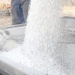 Fertilizer is being dumped and augered.