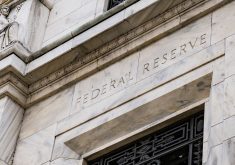 A photo of the facade of the U.S. Federal Reserve building.