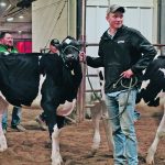 Kyle Vaandrager gets ready to show his prize clipping job during the senior level clipping results. Being a graduating member of Team BC, Vaandrager had a lot to share with his younger teammates. | Becky Zimmer photo